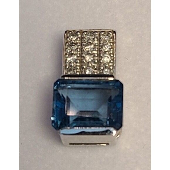 14 K White Gold Blue Topaz With 12 Round Diamonds Pendant